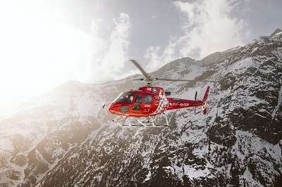 Helicopter over a mountain covered with snow at Kedarnath